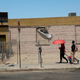 People walk downtown as the temperature reached around 115 degrees in early June in Calexico, California.